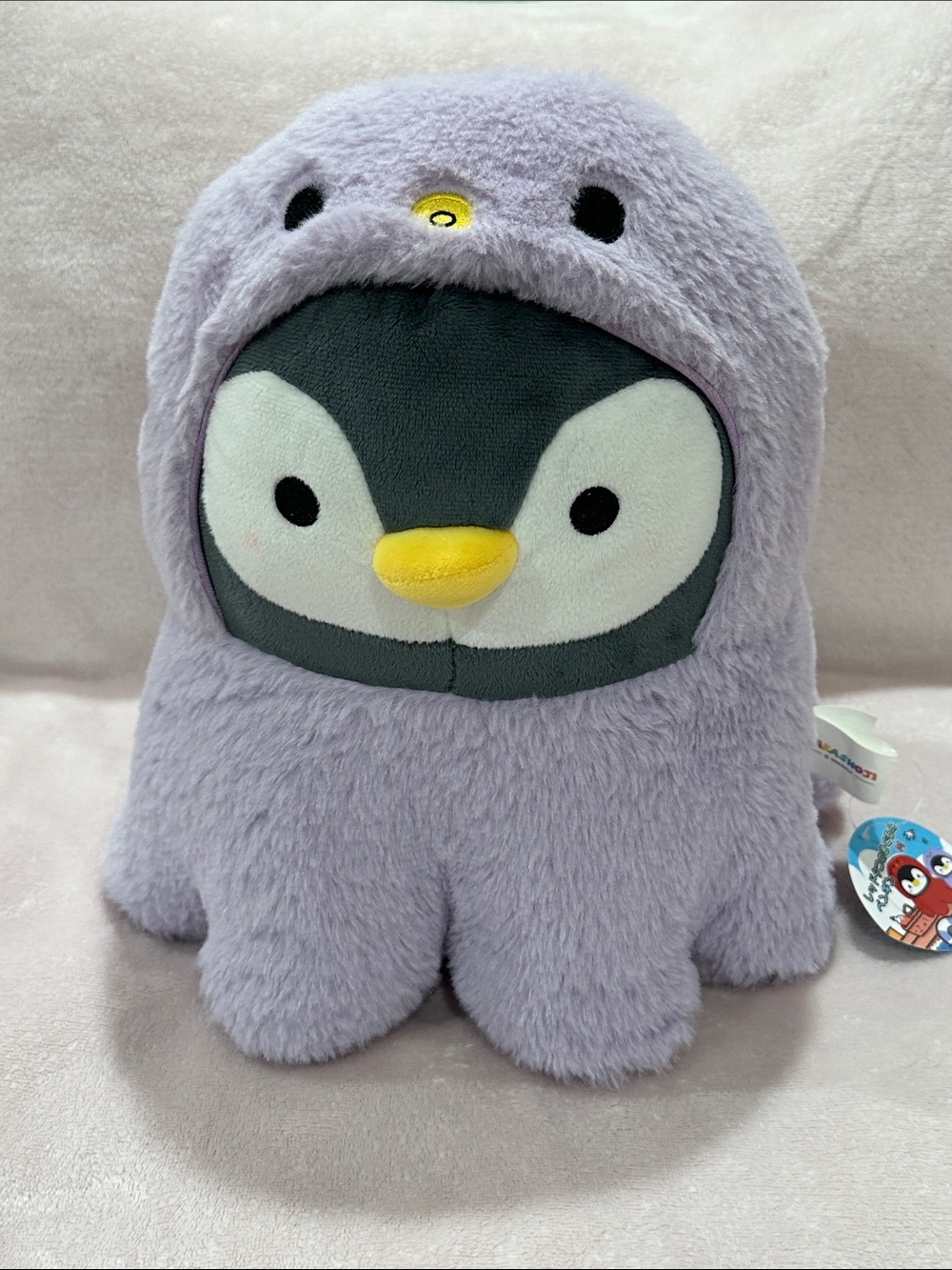 Takashoji plush penguin with purple lavender octopus costume